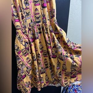 Pinup Couture yellow and pink birdcage dress.